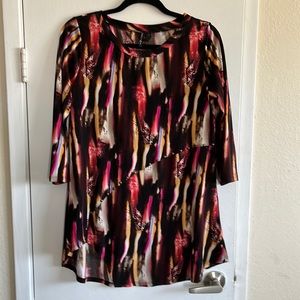 Bright colored tunic. Classy! Styled with rivets and shorter on right thigh. M